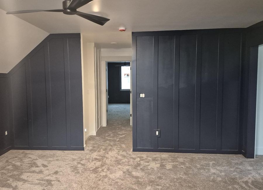 Navy board-and-batten bonus room