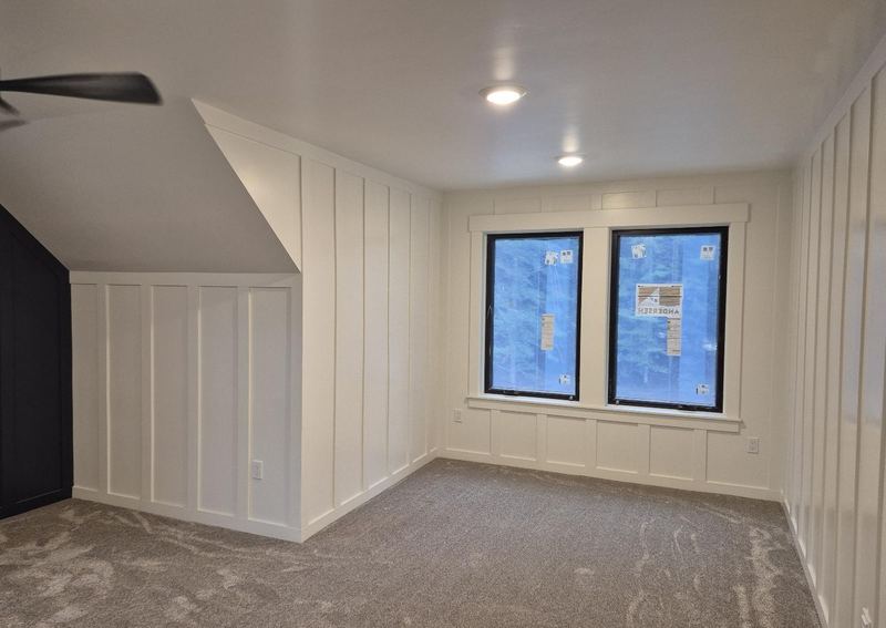 White board-and-batten bonus room